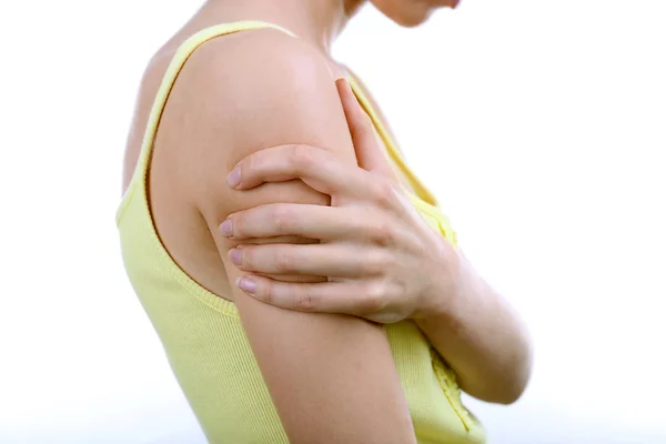 Young woman with shoulder pain isolated on white — Stock Photo, Image