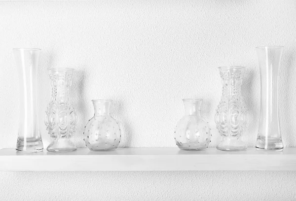 Decorative vases on wooden shelf — Stock Photo, Image