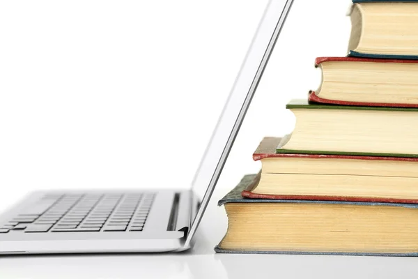 Stack of books with laptop — Stock Photo, Image