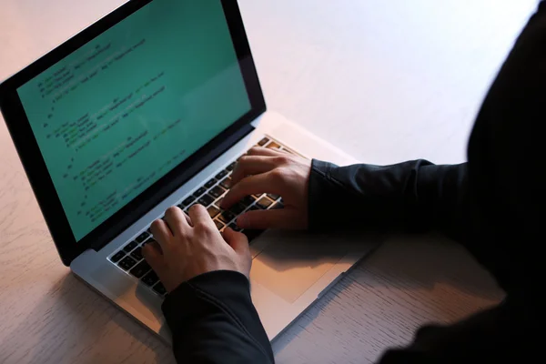 Hacker with laptop — Stock Photo, Image