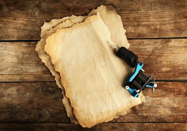 Machine for tattoo with old paper — Stock Photo, Image