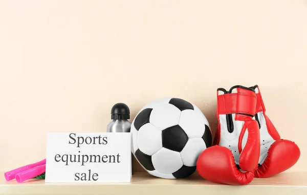 Sport goods for sale, on light wall background — Stock Photo, Image