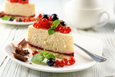 Delicious cheesecake with berries clipart