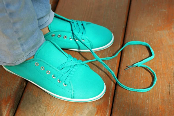 Female feet in gum shoes — Stock Photo, Image