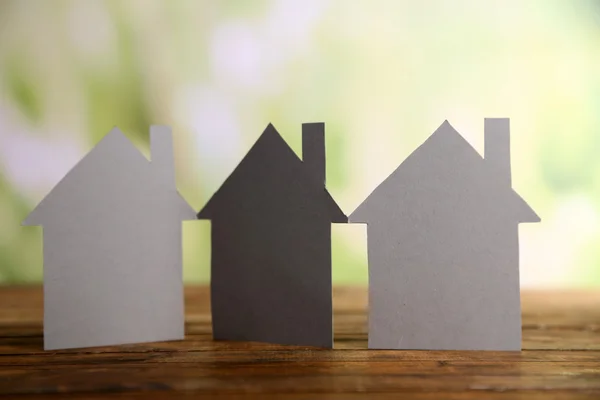 Paper houses on bright background — Stock Photo, Image