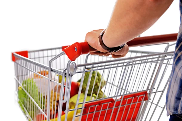 Young man with shopping cart close up — Stock Photo, Image