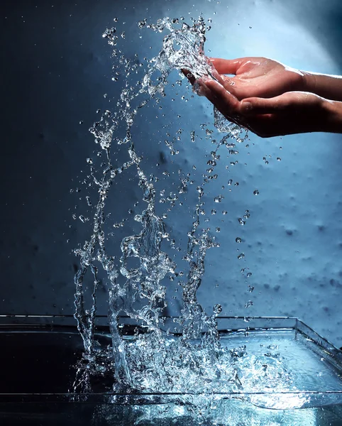 Female hands with water splashing — Stock Photo, Image