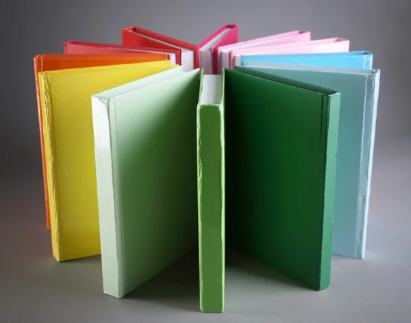 Colorful books on gray background — Stock Photo, Image