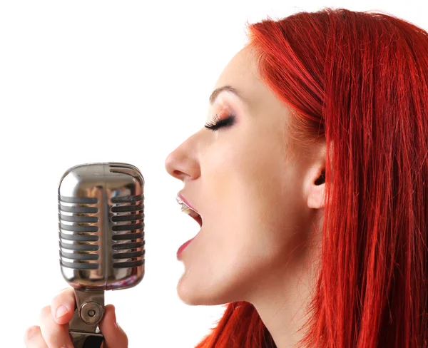 Woman singing with microphone — Stock Photo, Image