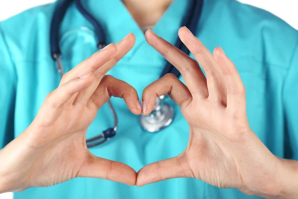 Doctor's hands making heart shape — Stock Photo, Image