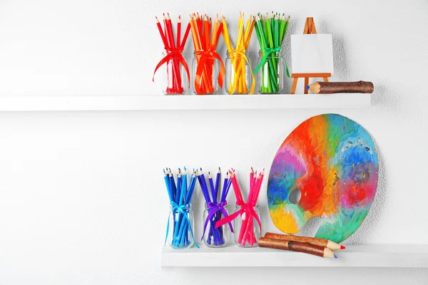 Bright pencils in glass jars — Stock Photo, Image