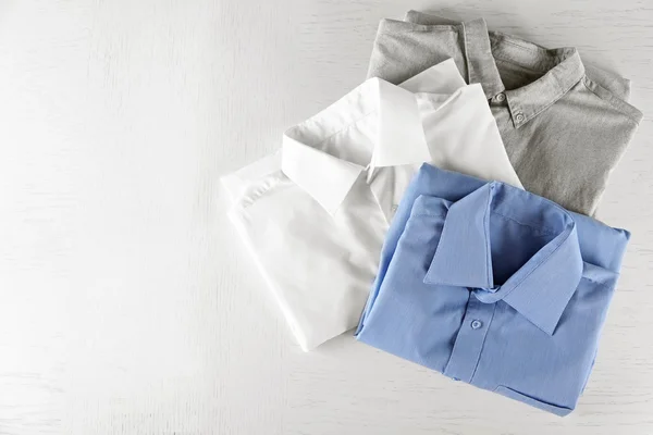 Business shirts on white table — Stock Photo, Image