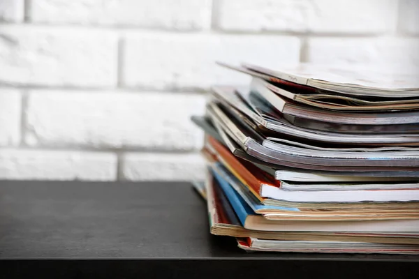 Stack of magazines on table — Stock Photo, Image