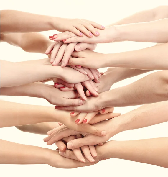 People's hands together on light background — Stock Photo, Image