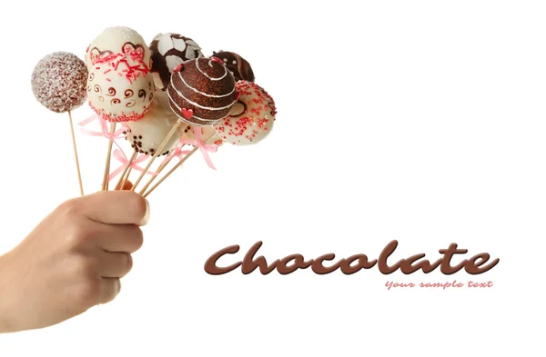 Female hand holding cake pops, isolated on white — Stock Photo, Image