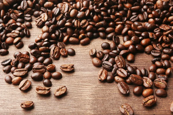 Coffee beans on wooden background — Stock Photo, Image