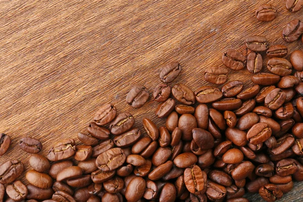 Coffee beans on wooden background — Stock Photo, Image