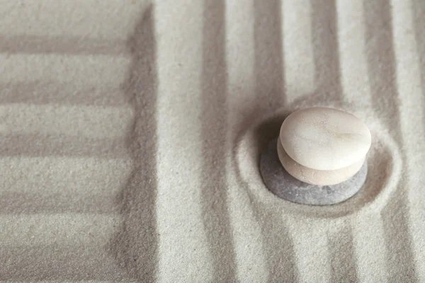 Zen garden with stones on sand background — Stock Photo, Image