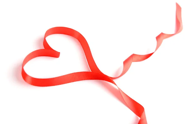 Red ribbon in shape of heart isolated on white — Stock Photo, Image