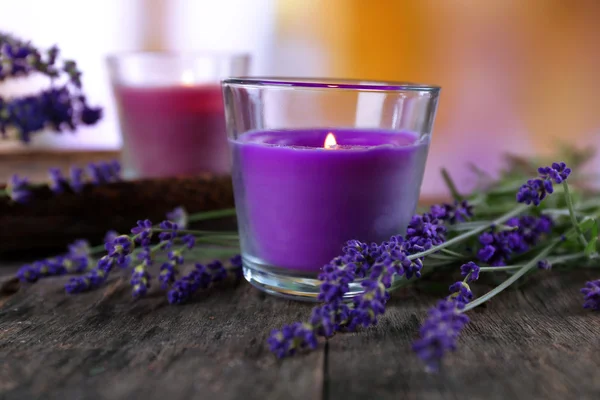 Candles with lavender flowers on table close up — Stock Photo, Image