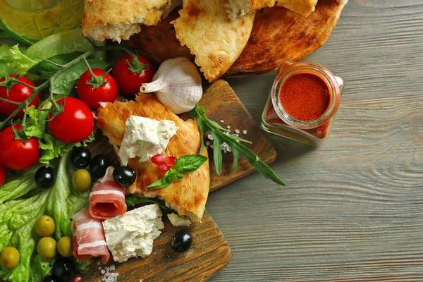 Ingredients of Mediterranean cuisine, on wooden board, close-up — Stock Photo, Image