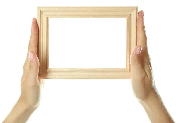 Female hands with wooden frame — Stock Photo, Image