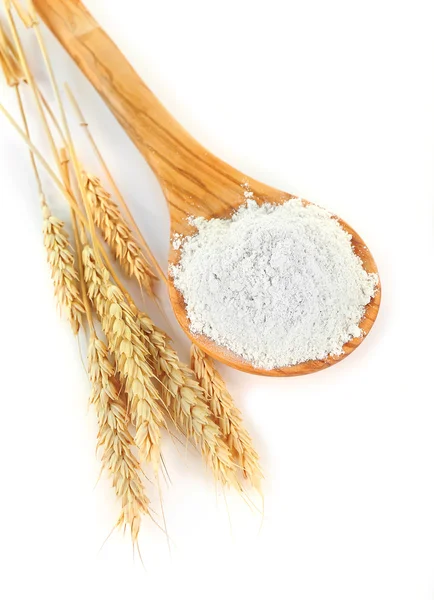 Wheat flour in wooden spoon — Stock Photo, Image