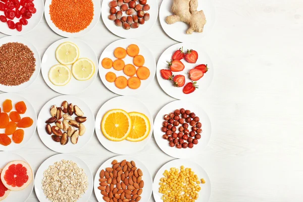 Set of orange products on wooden background — Stock Photo, Image