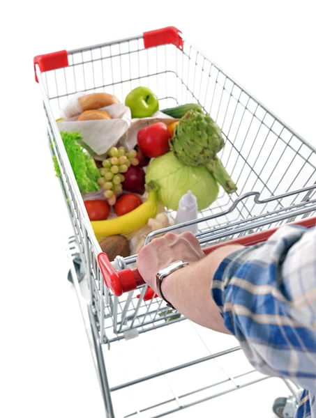 Young man with shopping cart — Stock Photo, Image