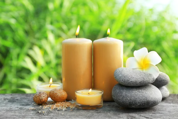 Spa still life on wooden surface over green reeds on river — Stock Photo, Image