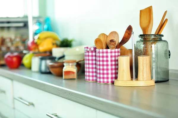 Composition with different utensils on wooden wooden table in kitchen — Stock Photo, Image