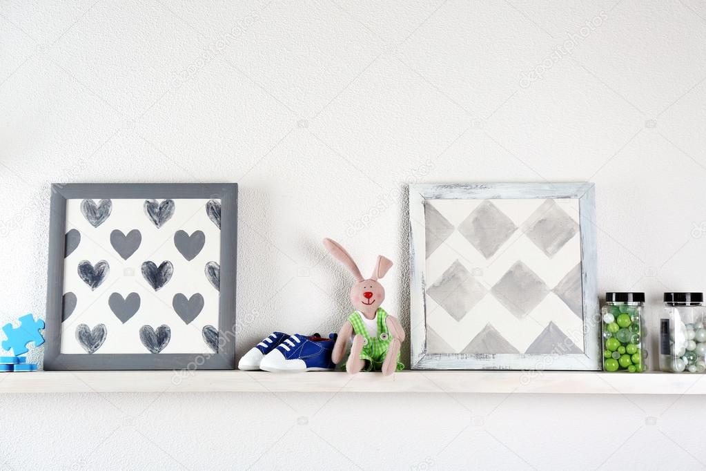 Shelves with toys in child room — Stock Photo © belchonock 81424798