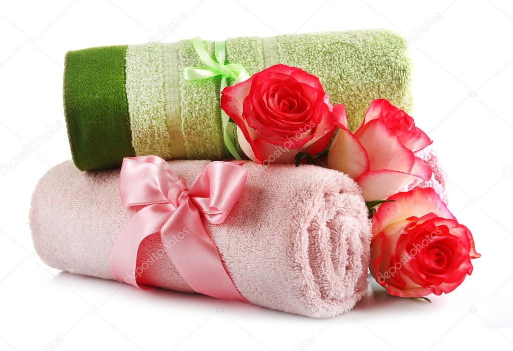 Rolled up colorful towels isolated on white