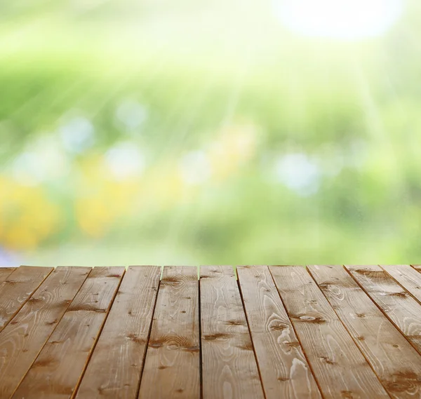 Wooden table  with abstract  blur background — Stock Photo, Image