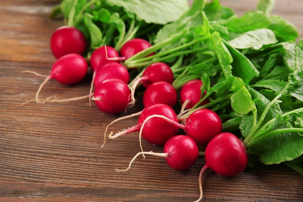 Fresh red radish on wooden table, closeup — Stock Photo, Image