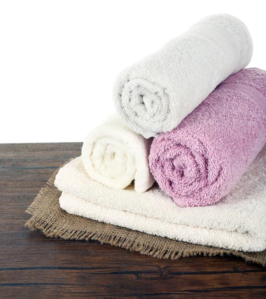 Soft towels on table isolated on white — Stock Photo, Image