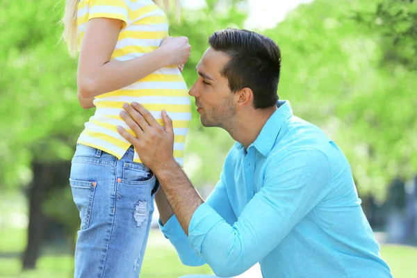 Young pregnant woman with husband in park — Stock Photo, Image