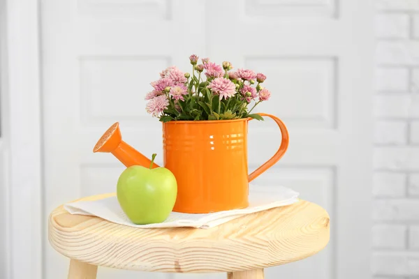 Beautiful flowers in decorative vase on light background — Stock Photo, Image