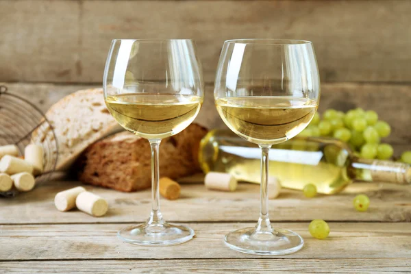 Still life of wine and bread on rustic wooden background — Stock Photo, Image