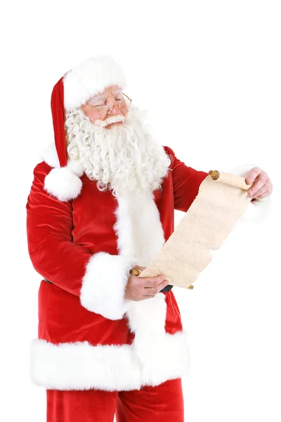 Santa Claus holding wish list — Stock Photo, Image