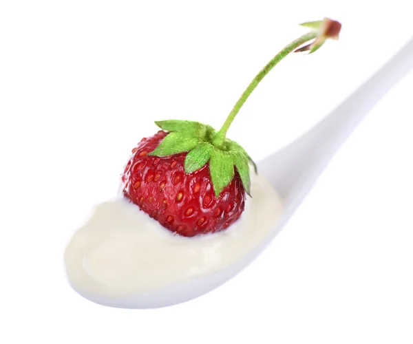 Delicious yogurt in spoon with strawberry isolated on white — Stock Photo, Image