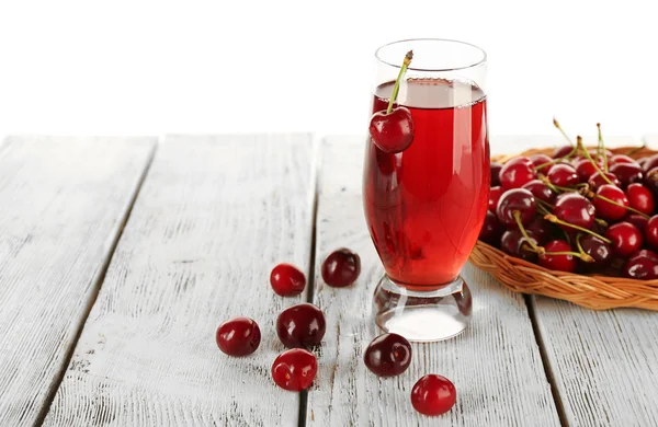 Glass of fresh juice with cherries on wooden table close up — Stock Photo, Image