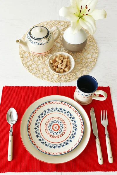 Table setting with red napkin — Stock Photo, Image