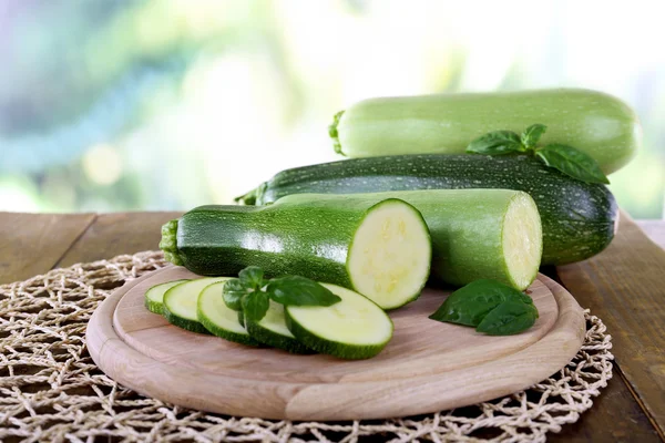 Fresh zucchini with squash and basil on table close up — Stock Photo, Image