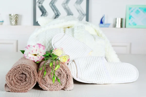 Bathrobe, towels and slippers — Stock Photo, Image