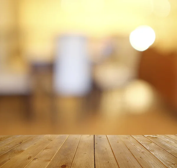 Wooden table with abstract blur — Stock Photo, Image