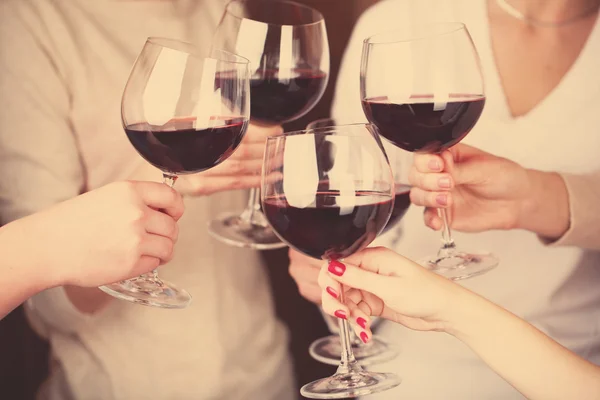 Female hands with glasses of wine — Stock Photo, Image