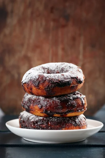 Delicious doughnuts with chocolate icing — Stock Photo, Image