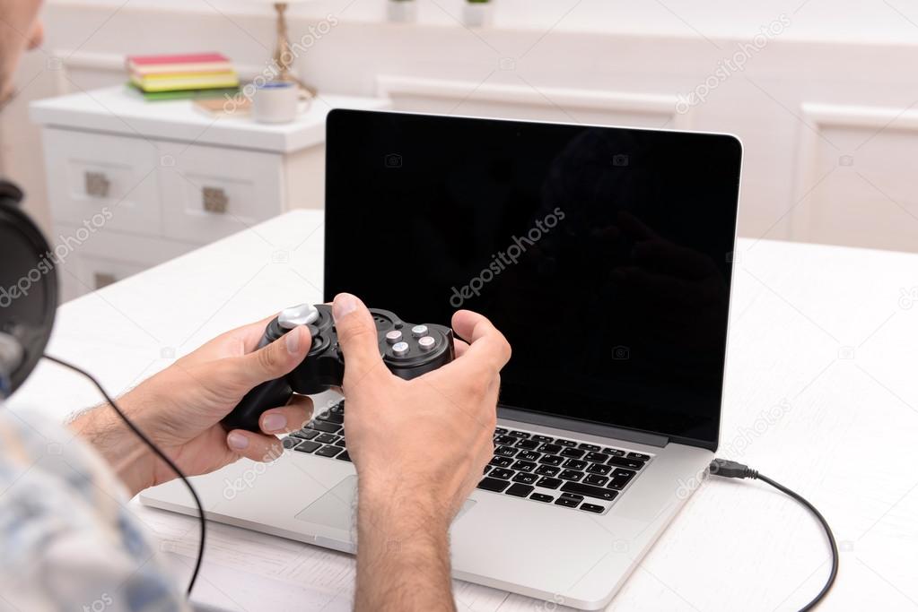 man playing computer games 