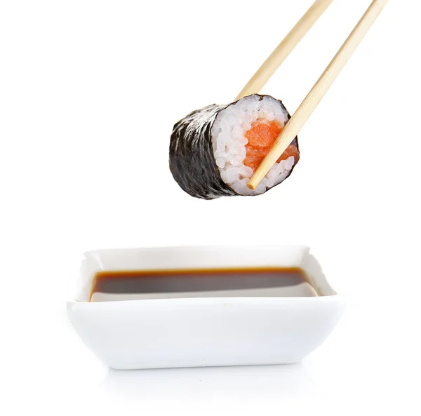 Dipping roll in sauce isolated on white — Stock Photo, Image